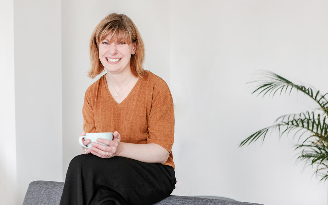 Headshots in co-working space in southampton, woman sitting with coffee on couch
